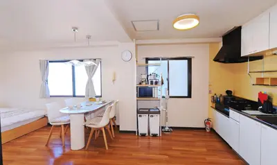 a small kitchen with a table and chairs in a room at SkyTree-401 in Tokyo