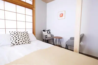 a bedroom with a bed and a window at Yumenoya Yoyogi in Tokyo
