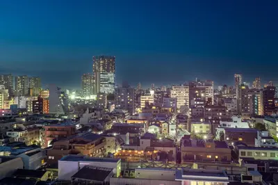 a city skyline at night with lit up buildings at \u30ec\u30b8\u30c7\u30f3\u30b7\u30e3\u30eb\u30b9\u30c6\u30fc\u30b81107 in Tokyo