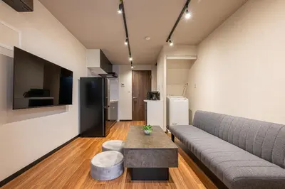 a living room with a couch and a table at Newly Opened \u6c60\u888b\u30c6\u30e9\u30b9\u30cf\u30a6\u30b9A in Tokyo