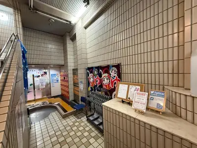 a hallway of a building with signs on the wall at Newly Opened \u6c60\u888b\u30c6\u30e9\u30b9\u30cf\u30a6\u30b9A in Tokyo