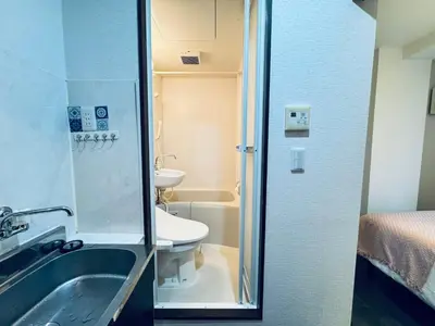 a small bathroom with a sink and a toilet at Shinjuku JX-101 SJ0283 in Tokyo