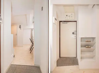 a hallway with a door leading into a room at Japan House Shirokane in Tokyo