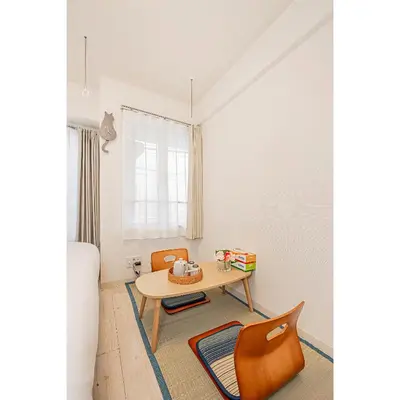 a small room with a table and chairs at Japan House Shirokane in Tokyo
