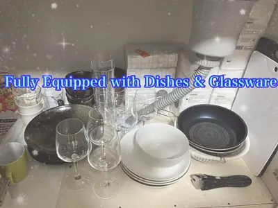 a kitchen counter with wine glasses and dishes on it at \u99c5\u5f92\u6b6910\u5206\u30c7\u30a3\u30ba\u30cb\u30fc25\u5206\u30b9\u30ab\u30a4\u30c4\u30ea\u30fc\u6d45\u834930\u5206\u8cb8\u5207\u4e00\u68df\u6700\u59275\u540d\u5927\u578b\u30b7\u30e7\u30c3\u30d4\u30f3\u30b0\u30e2\u30fc\u30eb1\u5206 in Tokyo