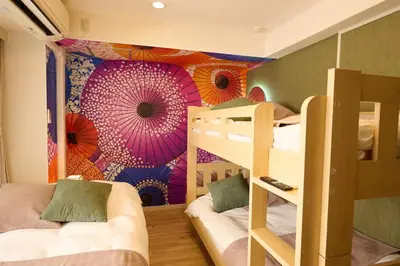 a room with bunk beds and a wall with umbrellas at 1min to Station 25min Disney Resort Direct Narita 1Transfer Shibuya CVS 30s Girls Trip Family Stay \u99c5\u5f92\u6b691\u5206 \u30c7\u30a3\u30ba\u30cb\u30fc\u30ea\u30be\u30fc\u30c825\u5206 \u6210\u7530\u7a7a\u6e2f\u76f4\u901a \u6e0b\u8c371\u56de\u4e57\u63db \u30b3\u30f3\u30d3\u30cb30\u79d2 \u5973\u5b50\u65c5 \u5bb6\u65cf\u65c5\u884c in Tokyo