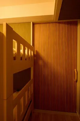 a staircase in a room with a wooden wall at 1min to Station 25min Disney Resort Direct Narita 1Transfer Shibuya CVS 30s Girls Trip Family Stay \u99c5\u5f92\u6b691\u5206 \u30c7\u30a3\u30ba\u30cb\u30fc\u30ea\u30be\u30fc\u30c825\u5206 \u6210\u7530\u7a7a\u6e2f\u76f4\u901a \u6e0b\u8c371\u56de\u4e57\u63db \u30b3\u30f3\u30d3\u30cb30\u79d2 \u5973\u5b50\u65c5 \u5bb6\u65cf\u65c5\u884c in Tokyo