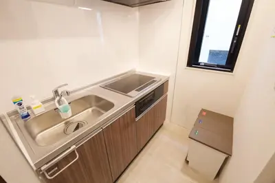 a small kitchen with a sink and a window at Heureux Shiinamachi 201 in Tokyo