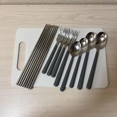 a group of utensils sitting on a white plate at \u6953 -Kaede- in Tokyo