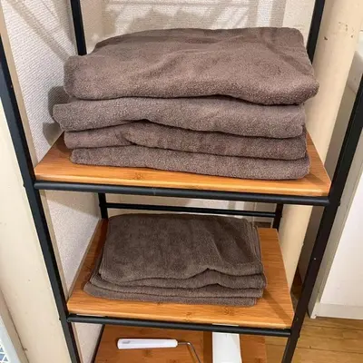 a pile of towels are on a shelf at \u6953 -Kaede- in Tokyo