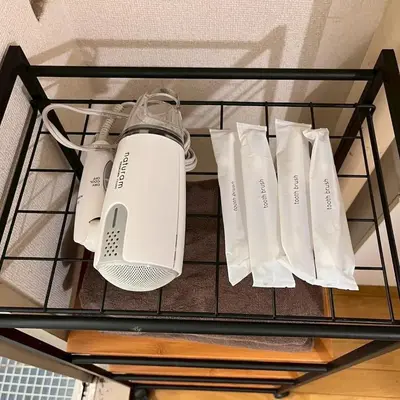 a wire shelf with white products on it at \u6953 -Kaede- in Tokyo