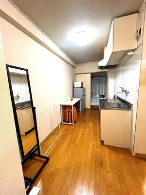 a kitchen with a sink and a mirror in a room at \u6953 -Kaede- in Tokyo