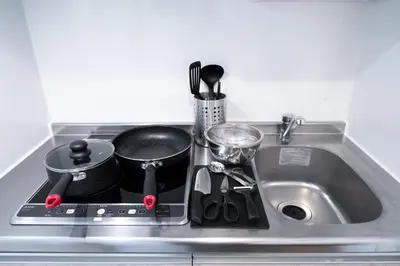 a kitchen sink with pots and pans on it at monthly PRIME asakusa in Tokyo