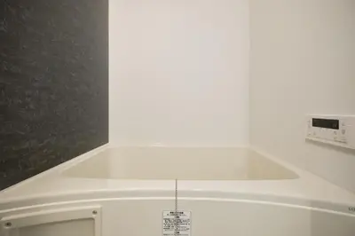 a white kitchen with a white counter top at monthly AQUA RESIDENCE Sangenjaya in Tokyo