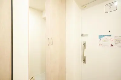 a door to a shower in a room at monthly AQUA RESIDENCE Sangenjaya in Tokyo