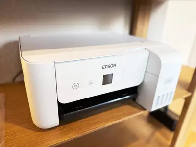 a white computer printer sitting on a shelf at \u62b9\u8336\u5eb5\u4e09\u8336\u6771\u4eac Matcha-An Sancha Tokyo #202 in Tokyo