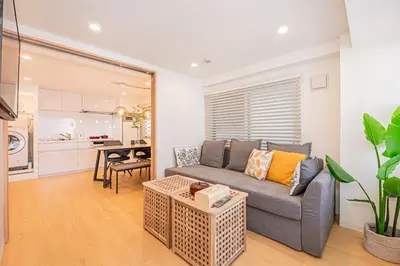 a living room with a couch and a table at 120sqm 5LDK 3-Stories House 3BT JR Shin-Okubo 5min in Tokyo