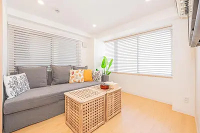 a living room with a couch and a table at 120sqm 5LDK 3-Stories House 3BT JR Shin-Okubo 5min in Tokyo