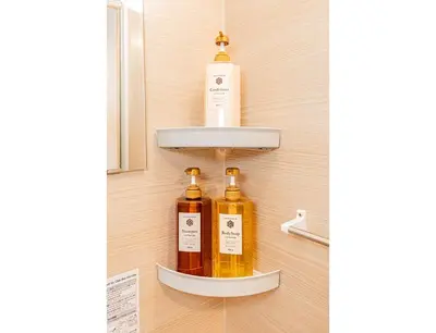 two bottles of essential oils on a shelf in a bathroom at 120sqm 5LDK 3-Stories House 3BT JR Shin-Okubo 5min in Tokyo
