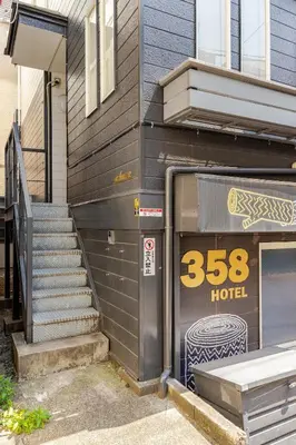 a facade of a building with a door and stairs at Rtt\u5357\u5143\u753a12 in Tokyo