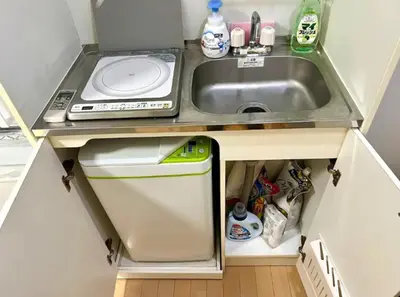 a small kitchen with a sink and a dishwasher at Gracious Higashishinjuku - Vacation STAY 35567v in Tokyo