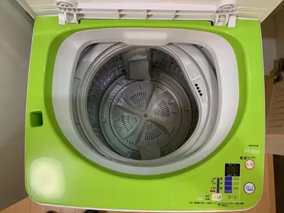 a green and white washing machine in a room at Gracious Higashishinjuku - Vacation STAY 35525v in Tokyo