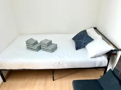 a bed with towels on top of it in a room at Gracious Higashishinjuku - Vacation STAY 35525v in Tokyo