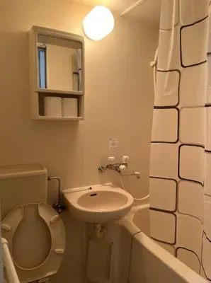 a small bathroom with a toilet and a sink at Fuji Flats - Vacation STAY 35595v in Tokyo
