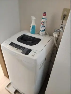 a washer and dryer with two bottles on top of it at Fuji Flats - Vacation STAY 35595v in Tokyo