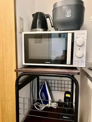 a microwave sitting on top of a shelf at Fuji Flats - Vacation STAY 35595v in Tokyo