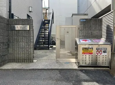 a trash can sitting next to a building with a staircase at Fuji Flats - Vacation STAY 35595v in Tokyo