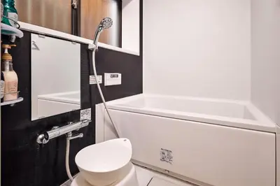 a bathroom with a white toilet and a shower at \u3068\u307e\u308a\u30fc\u3068Stay \u5e61\u30f6\u8c37 \u6e0b\u8c37\u533a Tomareat Stay Hatagaya Shibuya City in Tokyo