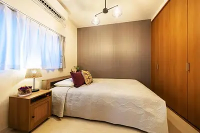 a small bedroom with a bed and a window at Disney nearby! 4bedroom family with airport access-Nobu in Tokyo