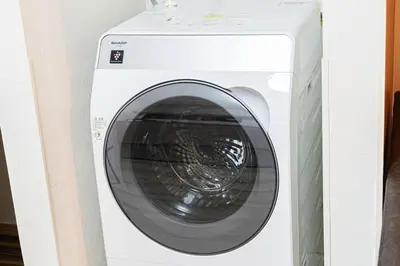 a white washing machine in a white cabinet at Disney nearby! 4bedroom family with airport access-Nobu in Tokyo
