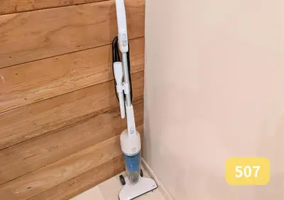 a white toothbrush hanging from the corner of a wall at Westside Shinjuku-Gyoen 507 in Tokyo