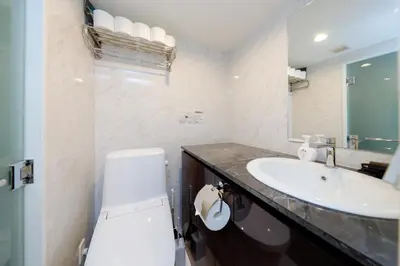a bathroom with a toilet and a sink at monthly Ra Grande in Tokyo