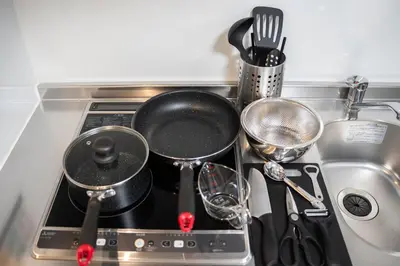 a stove top with pots and pans on it at monthly prime shinjuku in Tokyo
