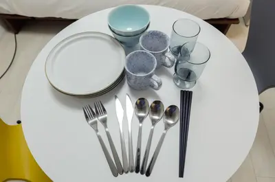a white table with utensils on top of it at monthly RECO WASEDA in Tokyo