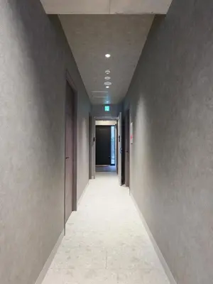 an empty hallway with a long corridor at LANG Hotel Kitaueno in Tokyo