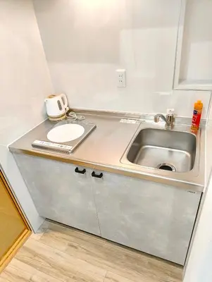 a small kitchen with a sink and a sink at Nippori mansion#Arakawa-ku in Tokyo