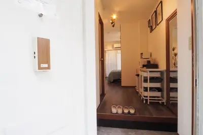 a hallway with a room with a bed and a table at Etoile Kagurazaka-Queen Room near Shinjuku, Self Check-in in Tokyo