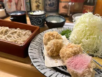 a plate of food with sushi and noodles on a table at Etoile Kagurazaka-Queen Room near Shinjuku, Self Check-in in Tokyo