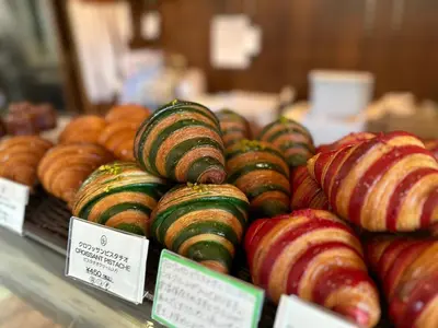 a display of donuts and other pastries in a bakery at Etoile Kagurazaka-Queen Room near Shinjuku, Self Check-in in Tokyo
