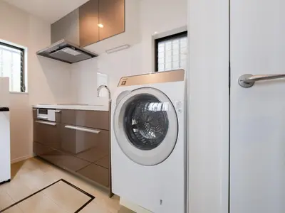 a kitchen with a washing machine in a kitchen at Shibuya Sta 10min walk Kingbed VR Switch Wi-Fi in Tokyo