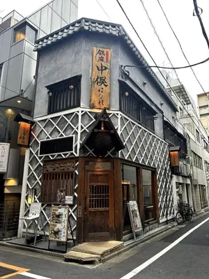 a building with an asian writing on it on a street at GInza6-7F in Tokyo