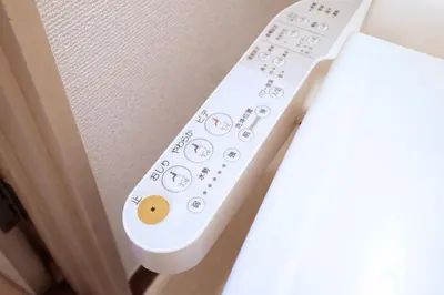 a white remote control sitting on top of a couch at Yoyogi New Flats - Vacation STAY 20254 in Tokyo