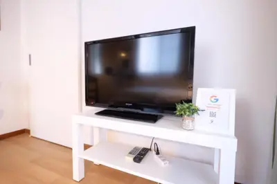 a flat screen tv on a white tv stand at Yoyogi New Flats - Vacation STAY 20254 in Tokyo