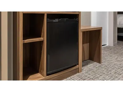 a small black refrigerator in a wooden cabinet at Far East Village Hotel Tokyo Ariake - Vacation STAY 44125v in Tokyo