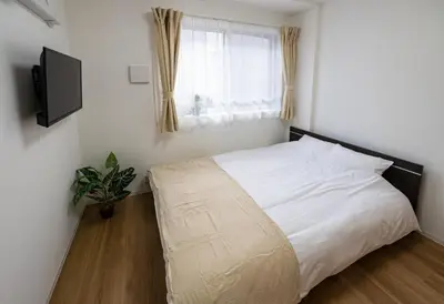 a bedroom with a white bed and a window at Repure Omori Residence 401 - Vacation STAY 20221 in Tokyo