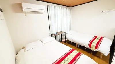 a small room with two beds and a window at Espoir - Vacation STAY 42528v in Tokyo